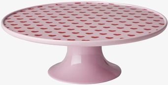 Bild av melaminfat med hjärtmönster och rosa sockel