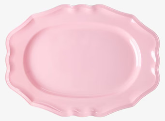 Bild av ett mjukt rosa serveringsfat med vågformad kant