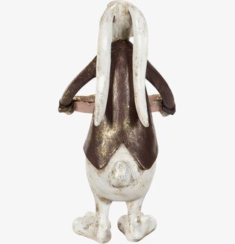 Bild av charmig kaninfigur med fat och detaljer