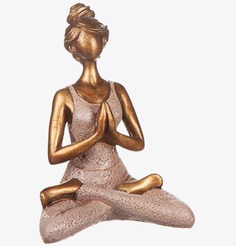 Bild av elegant rosa yogaskulptur i meditativ stillhet