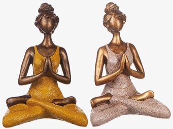 Bild av två meditativa skulpturer i gyllene toner