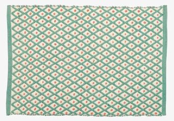 Bild av mintfärgad dörrmatta med harlequinmönster