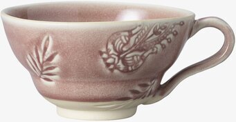 Bild av kopp med arabeskinspirerat reliefmönster