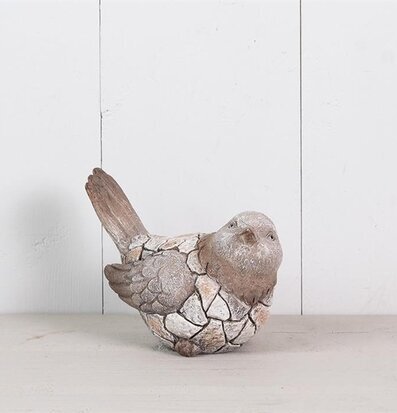 Foto av dekorativ trädgårdsfigur som föreställer fågel