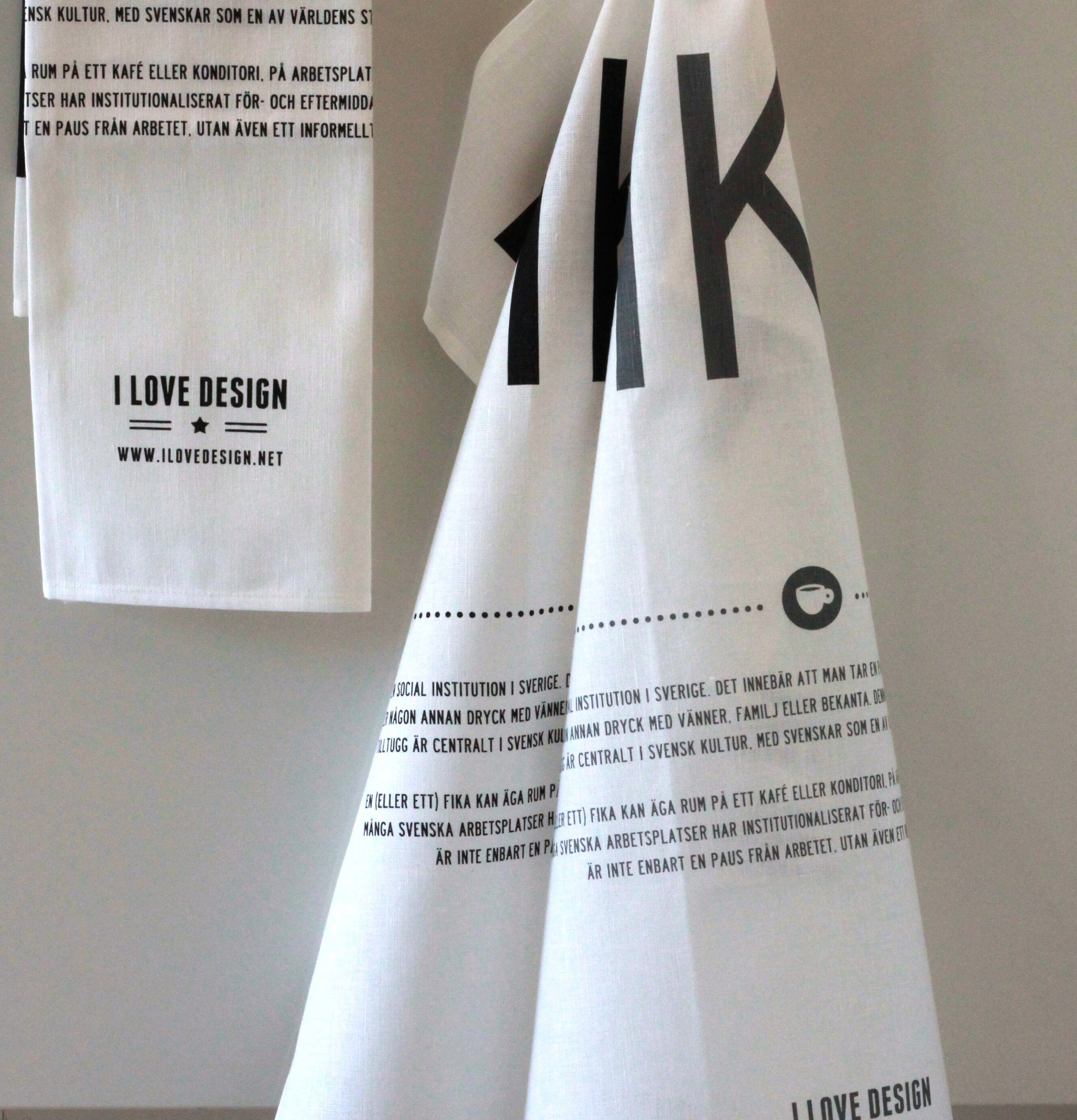 Bild av kökshanddukar med stilren design och fika-tema