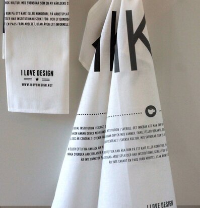 Bild av kökshanddukar med stilren design och fika-tema