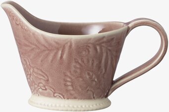 Foto av keramisk tillbringare med blommigt mönster