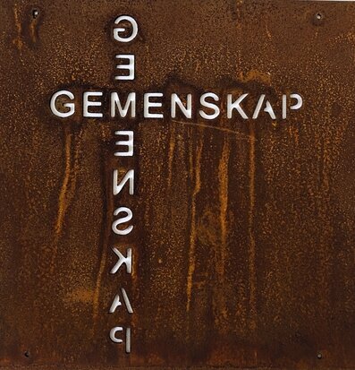 Bild av skylt med gemenskapstema och rostig charm