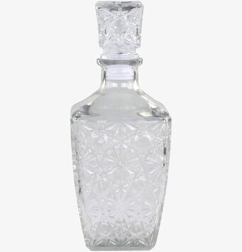 Foto av elegant glaskaraff med blommönster