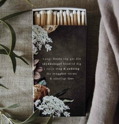Bild av elegant tändsticksask med poetisk text