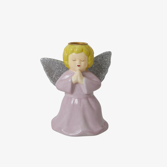 Bild av ljushållare formad som en ängel i rosa keramik