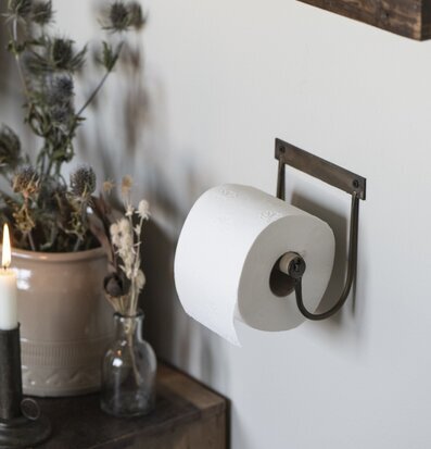 Bild av stilren toalettpappershållare och inredning