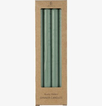 Bild av gröna rustika stearinljus i kartongförpackning