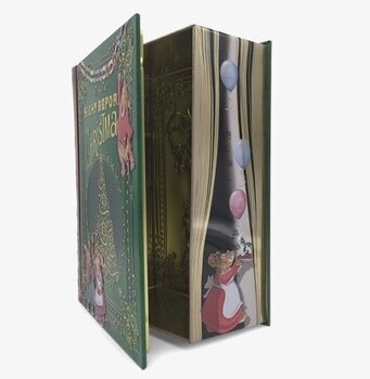 Bild av en plåtburk som imiterar en julberättelsebok