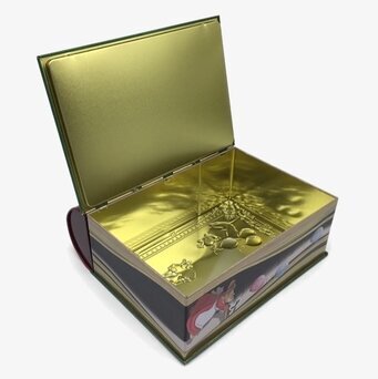 Bild av plåtburk som liknar en bok med juldesign