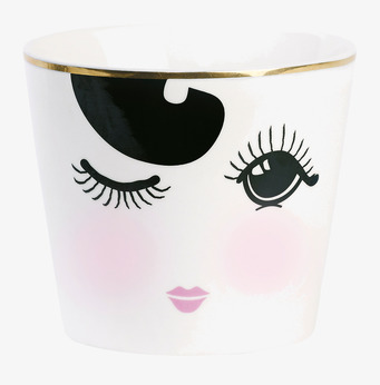 Bild av unik skål med grafiskt ansikte och guldkant