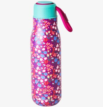 Bild av livfull dryckesflaska med blomstertryck