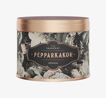 Bild av stilfull burk med vinterblommor och gyllene lock