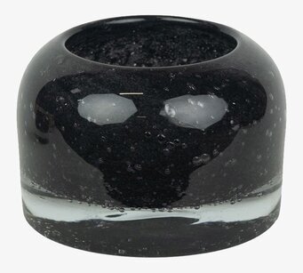 Bild av stilren svart ljuskopp i glas med bubblor