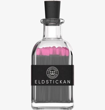 Bild av eleganta tändstickor i glasbehållare