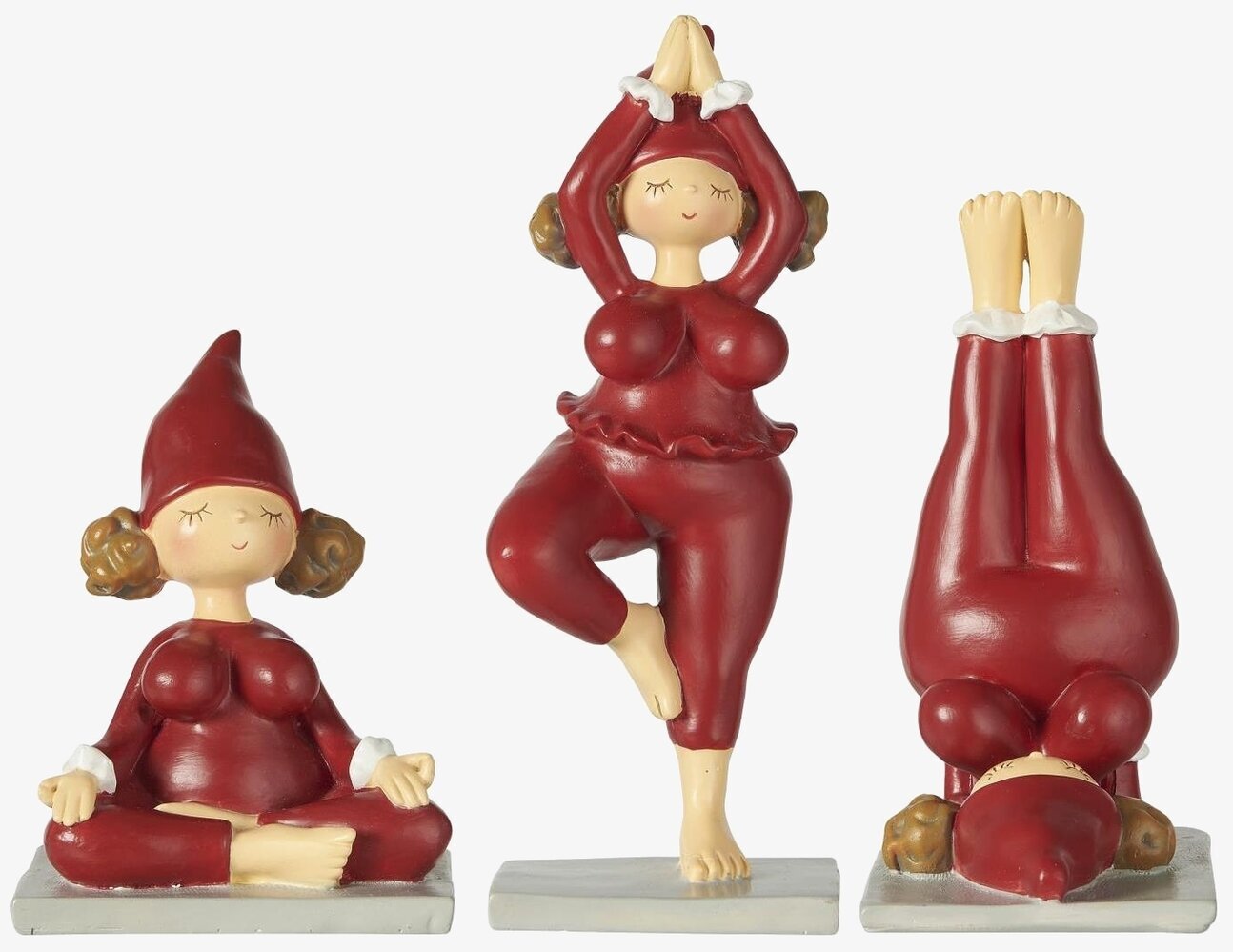 Bild av tre tomtetjejer i olika yogapositioner