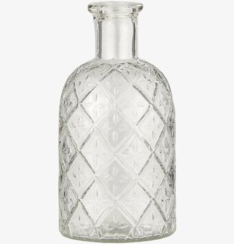 Bild av stilren och funktionell glasflaska med mönster