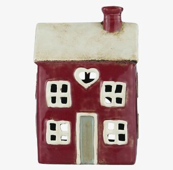 Foto av dekorativ ljuslykta formad som ett hus