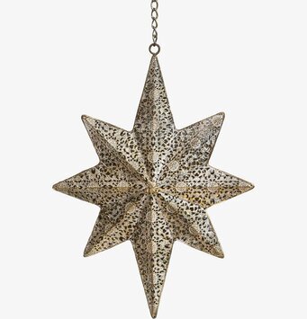 Foto av dekorativ stjärna i antik mässing med mönster