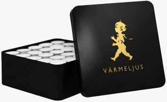 Bild av elegant svart burk med gyllene illustration