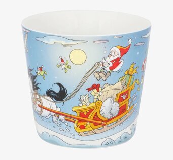 Bild av en färgglad julmugg med tomte och häst