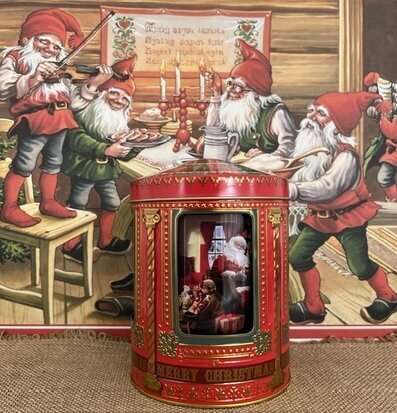 Bild av julscen på nostalgisk speldosa i plåtburk