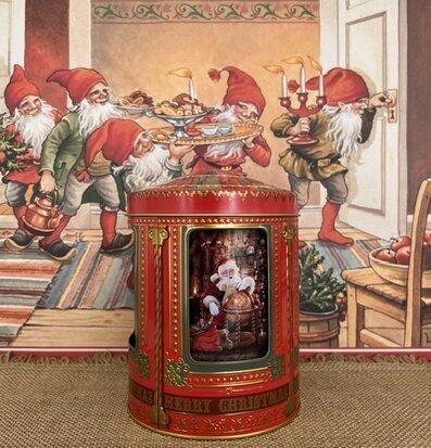 Bild av detaljrik plåtburk med julmotiv och speldosa