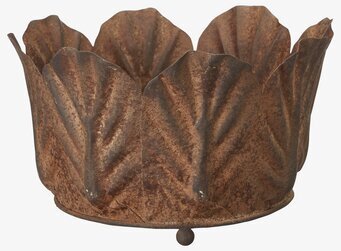 Foto av en rustik kruka med unik design i metall