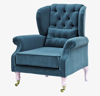 Bild av elegant fåtölj i petrol med tuftad design