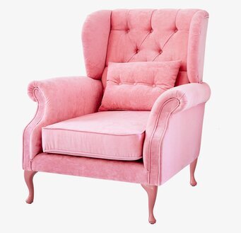 Bild av rosa sammetsfåtölj med eleganta detaljer
