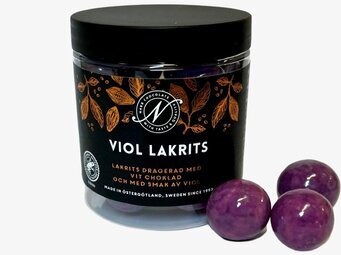 Bild av stilren burk med lakrits och chokladkulor