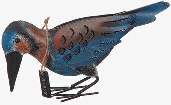 Foto av konstfullt utformad hackspettsfigur i metall