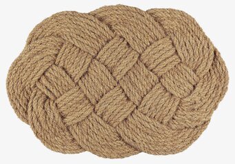 Foto av oval dörrmatta i flätad kokosfiber
