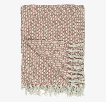 Bild av stilren pläd i creme och gammelrosa nyanser