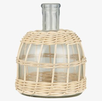 Bild av stilren vas i glas och rotting för inredning