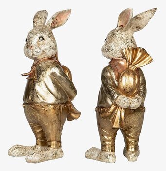 Foto av dekorativ kaninfigur i gyllene dräkt