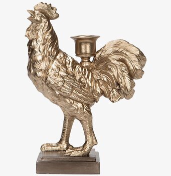 Bild av ljusstake formad som en tupp i champagneton