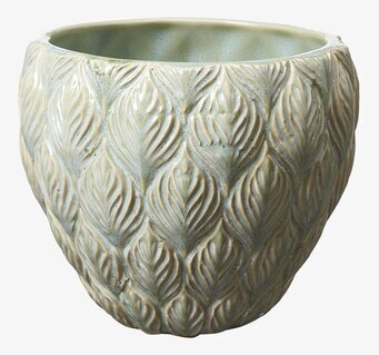 Foto av elegant ljusgrön kruka med skulptural design