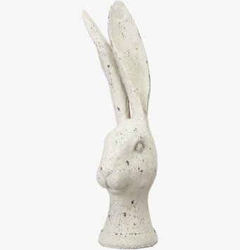 Bild av stiliserad kaninskulptur i vitmelerat material