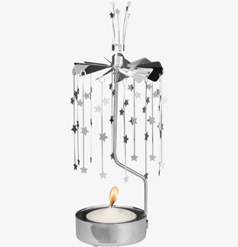 Bild av ett roterande änglaspel med stjärnor i metall