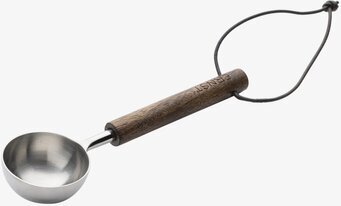 Bild av stilrent kaffemått med stål och trädetaljer