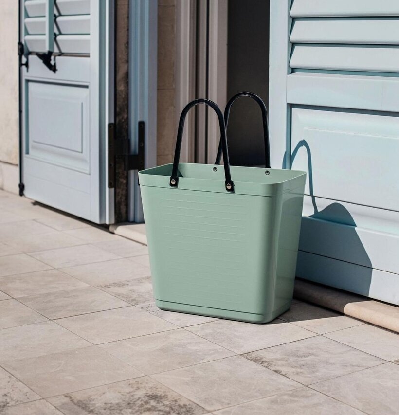 Bild av elegant olivgrön väska med stil och funktion