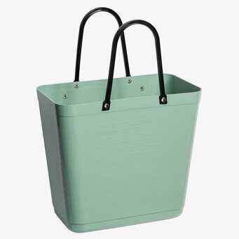 Bild av olivgrön väska med cykelfäste och praktisk design