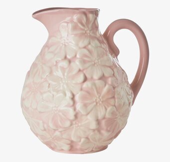 Bild av rosa keramikvas med blommönster i relief