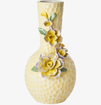 Bild av krämfärgad keramikvas med blommig dekoration